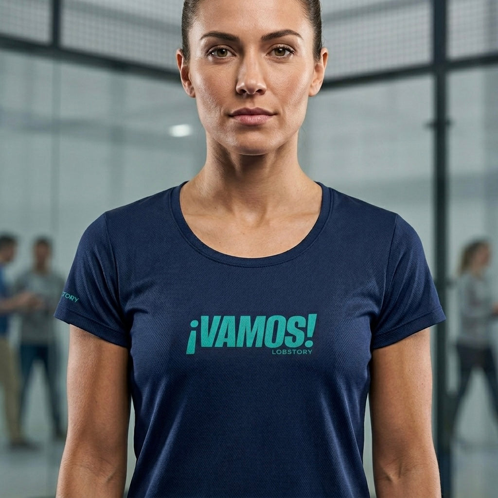 Female player on court wearing the navy blue ¡VAMOS! Performance Mesh Tee.