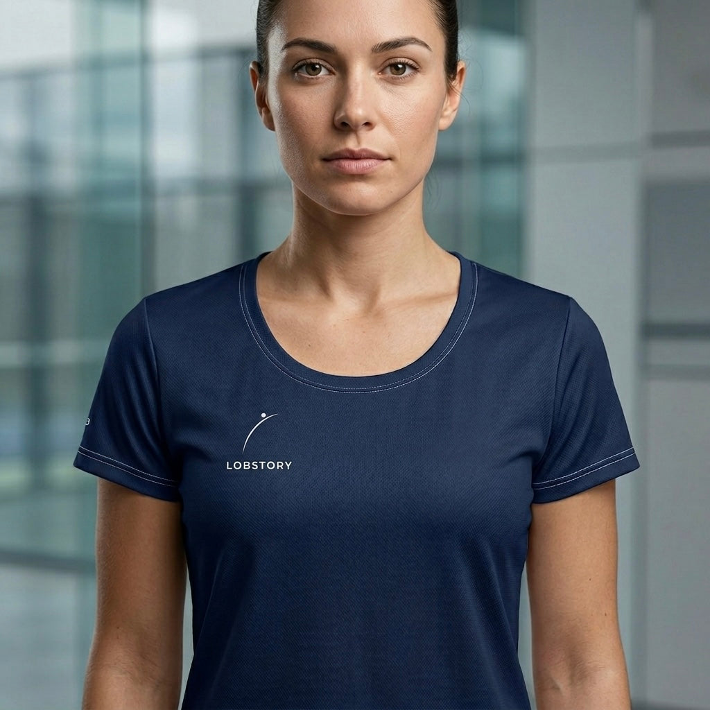 Female player wearing the navy blue Sweet Spot technical mesh tee for elite padel performance. lobstory