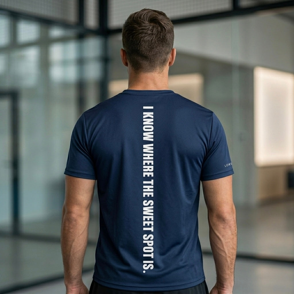 Rear view of a male model showing the high-contrast vertical branding on the Men's navy performance jersey. lobstory.eu